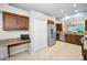 Bright kitchen featuring a breakfast bar and stainless steel refrigerator at 1528 Riverdale Dr, Oldsmar, FL 34677
