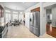 Bright kitchen with a refrigerator, pantry, and a cozy breakfast nook at 1528 Riverdale Dr, Oldsmar, FL 34677