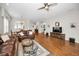 Open concept living area with hardwood floors, natural light, and a view to the dining room at 1528 Riverdale Dr, Oldsmar, FL 34677