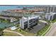 Stunning aerial view of the condominium complex, marina, and waterfront community with well-maintained landscaping at 1581 Gulf Blvd # 403N, Clearwater Beach, FL 33767
