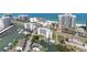 Picturesque aerial view of the waterfront property with a pool, marina, and nearby beach access at 1581 Gulf Blvd # 403N, Clearwater Beach, FL 33767