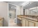 Well-maintained bathroom features neutral tile, marble counters, and seamless access to the connected shower and toilet room at 1581 Gulf Blvd # 403N, Clearwater Beach, FL 33767