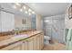 Well-lit bathroom features dual sinks, a large mirror, a walk-in shower, and an ample vanity at 1581 Gulf Blvd # 403N, Clearwater Beach, FL 33767