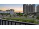 Picturesque sunset view of the property with lush landscaping, palm trees, and glimpses of the ocean at 1581 Gulf Blvd # 403N, Clearwater Beach, FL 33767