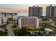 Stunning exterior view of a condo building with a waterfront pool and boat docks at 1581 Gulf Blvd # 403N, Clearwater Beach, FL 33767