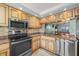 Well-equipped kitchen features stainless steel appliances and stone countertops with a pass-through to the dining area at 1581 Gulf Blvd # 403N, Clearwater Beach, FL 33767
