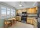 Well-equipped kitchen with stainless steel appliances, granite countertops, and ample cabinet space at 1581 Gulf Blvd # 403N, Clearwater Beach, FL 33767