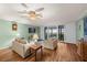 Bright living room featuring hardwood floors, comfortable furniture, and serene water views at 1581 Gulf Blvd # 403N, Clearwater Beach, FL 33767