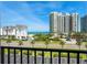 Relaxing view of the beach and nearby condos from an elevated vantage point on a high-rise balcony at 1581 Gulf Blvd # 403N, Clearwater Beach, FL 33767