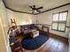 Bedroom with a ceiling fan, hardwood floors, and a storage chest at 1716 Bondurant Way, Brandon, FL 33511