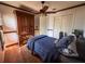 Bedroom with a ceiling fan, hardwood floors, and a large closet at 1716 Bondurant Way, Brandon, FL 33511