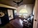 Bedroom with a ceiling fan, hardwood floors, and a large window at 1716 Bondurant Way, Brandon, FL 33511