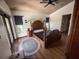 Cozy bedroom with a unique wood bed, natural light, and wood floors at 1716 Bondurant Way, Brandon, FL 33511