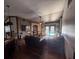 Living room with hardwood floors, a ceiling fan, and a stone fireplace at 1716 Bondurant Way, Brandon, FL 33511