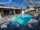 Inviting screened-in pool area with a patio and a relaxing atmosphere, perfect for outdoor enjoyment and entertaining at 1716 Bondurant Way, Brandon, FL 33511