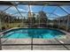 Relaxing screened pool area offers beautiful views of the outdoors and an area to retreat and enjoy the scenery at 1716 Bondurant Way, Brandon, FL 33511