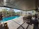 Screened-in pool area with a patio and outdoor dining set at 1716 Bondurant Way, Brandon, FL 33511
