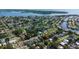 Aerial view of a residential neighborhood with lush greenery near the water at 1835 Michigan Ne Ave, St Petersburg, FL 33703