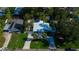 Overhead shot of a home with a pool, meticulously landscaped yard, and a long driveway with a circular turn at 1835 Michigan Ne Ave, St Petersburg, FL 33703
