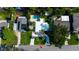 Aerial view showcasing the yard, swimming pool, driveway and solar panels at 1835 Michigan Ne Ave, St Petersburg, FL 33703