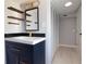 Stylish bathroom featuring a modern vanity, open shelving, and neutral colors at 1835 Michigan Ne Ave, St Petersburg, FL 33703