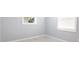 Cozy bedroom with neutral walls and bright natural light from the windows at 1835 Michigan Ne Ave, St Petersburg, FL 33703