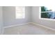 Bright bedroom with tile floors and natural light from the large windows at 1835 Michigan Ne Ave, St Petersburg, FL 33703
