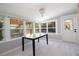 Light-filled dining room with large windows and view of backyard at 1835 Michigan Ne Ave, St Petersburg, FL 33703