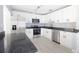 Well-equipped kitchen with stainless steel appliances, granite counters, and bright white cabinetry at 1835 Michigan Ne Ave, St Petersburg, FL 33703
