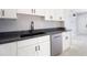 Updated kitchen featuring granite countertops, stainless steel dishwasher, and ample cabinet space at 1835 Michigan Ne Ave, St Petersburg, FL 33703
