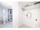 Bright laundry room with wire shelving and connections for a washer and dryer at 1835 Michigan Ne Ave, St Petersburg, FL 33703
