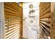 Outdoor shower with marble-look tile and wood slat privacy screen at 1835 Michigan Ne Ave, St Petersburg, FL 33703