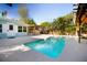 Outdoor pool with lounge area and pergola, creating a relaxing and private backyard oasis at 1835 Michigan Ne Ave, St Petersburg, FL 33703