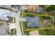 Aerial view of property highlighting the layout of the home, landscaping, and surrounding neighborhood at 1852 Longview Ln, Tarpon Springs, FL 34689