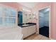 Bright bathroom with large vanity, and a view to the walk-in closet at 1852 Longview Ln, Tarpon Springs, FL 34689