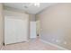 Neutral bedroom with a closet and tile flooring at 1852 Longview Ln, Tarpon Springs, FL 34689