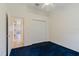 Bright bedroom with a closet and blue carpeting at 1852 Longview Ln, Tarpon Springs, FL 34689