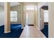 A well-lit foyer leads to rooms with high ceilings and arched openings at 1852 Longview Ln, Tarpon Springs, FL 34689