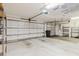 Garage with white doors and an automatic door opener at 1852 Longview Ln, Tarpon Springs, FL 34689
