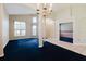 Open floor plan with arched entryways, leading to additional rooms, and windows providing plenty of natural light at 1852 Longview Ln, Tarpon Springs, FL 34689