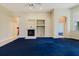 Bright living room featuring a cozy fireplace and neutral color palette at 1852 Longview Ln, Tarpon Springs, FL 34689