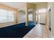 Spacious living room with large windows and an arched entry showcasing the home's open layout at 1852 Longview Ln, Tarpon Springs, FL 34689