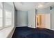 Bright primary bedroom featuring a bay window, tray ceiling, and en-suite bathroom access at 1852 Longview Ln, Tarpon Springs, FL 34689