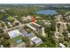 An aerial view of a property featuring a parking area and is near a lake at 2003 Greenbriar Blvd # 1, Clearwater, FL 33763