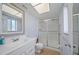 Bathroom with a glass-enclosed shower and vanity with a large mirror at 2003 Greenbriar Blvd # 1, Clearwater, FL 33763