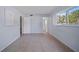 Spacious room features tile flooring, an ensuite bathroom, and a bright window at 2003 Greenbriar Blvd # 1, Clearwater, FL 33763