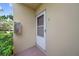 Condo entrance featuring a screen door and fire extinguisher at 2003 Greenbriar Blvd # 1, Clearwater, FL 33763