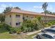 Charming condo building with well-manicured landscaping, inviting walkways, and ample parking at 2003 Greenbriar Blvd # 1, Clearwater, FL 33763