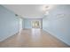 Spacious living room with tile flooring and sliding doors to the lanai at 2003 Greenbriar Blvd # 1, Clearwater, FL 33763