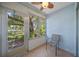 Sunroom with a ceiling fan and a chair with views of the outside landscaping at 2003 Greenbriar Blvd # 1, Clearwater, FL 33763